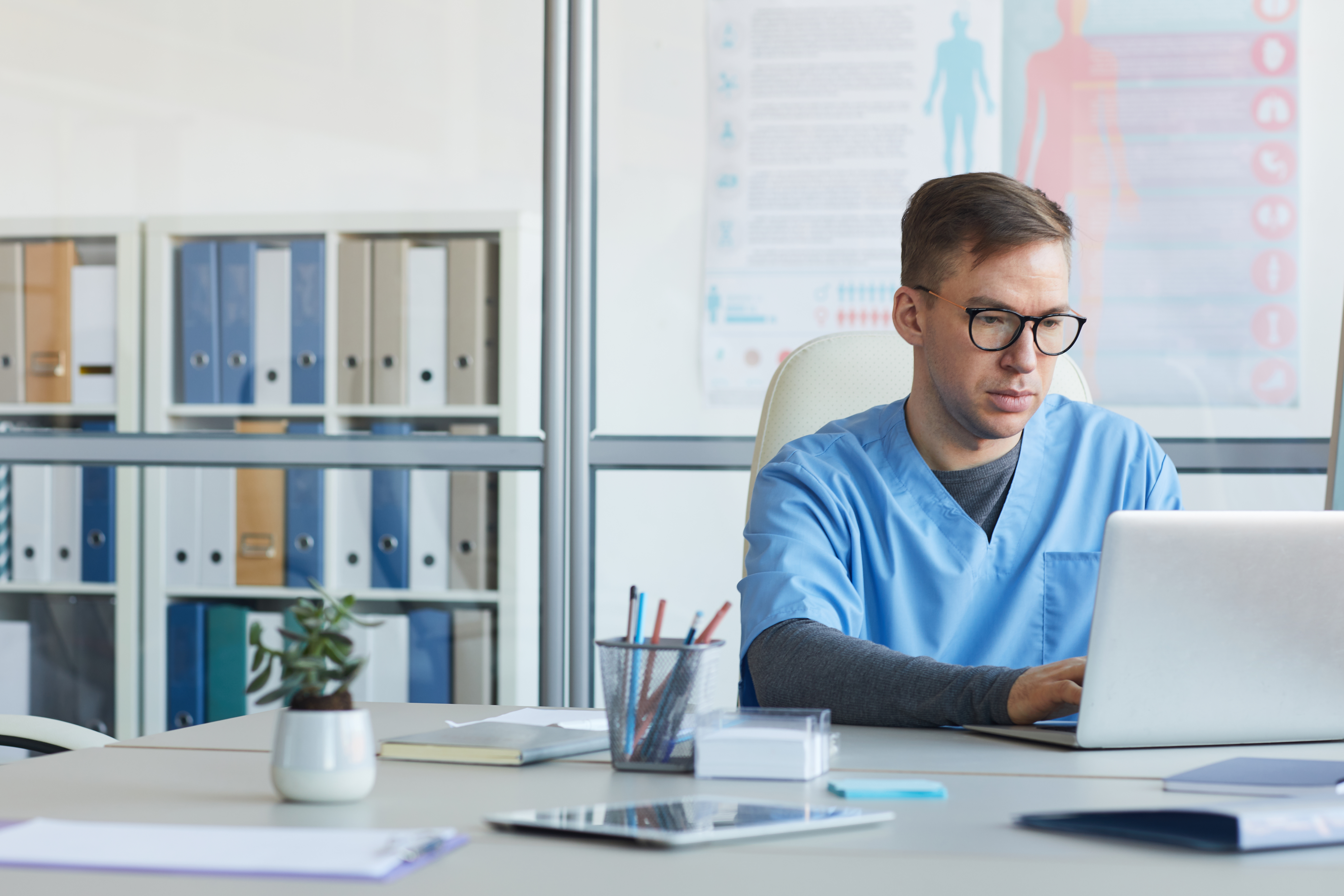 Doctor Using Computer in Clinic