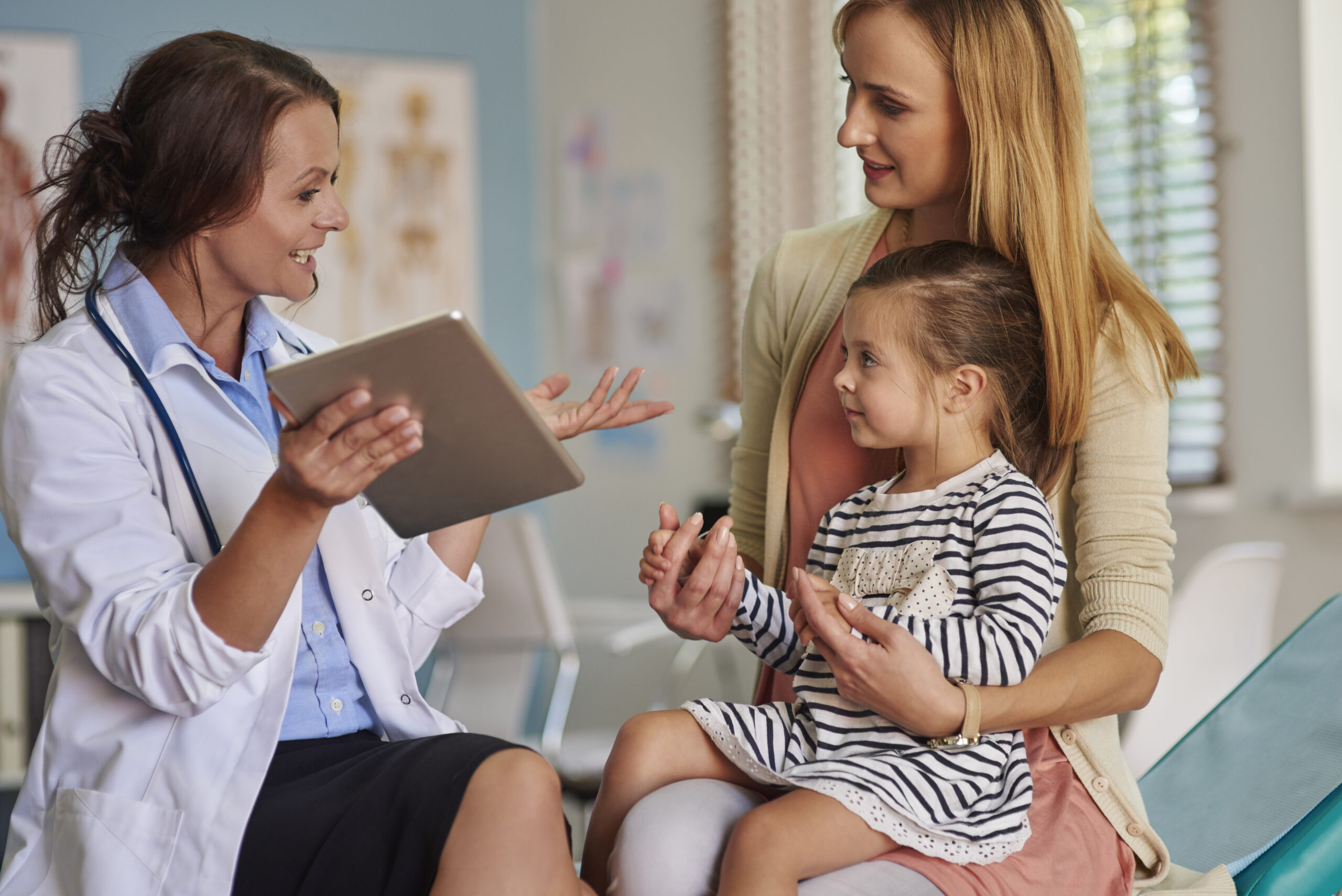 A doctor talking to a family