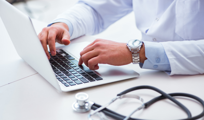 A doctor using a computer