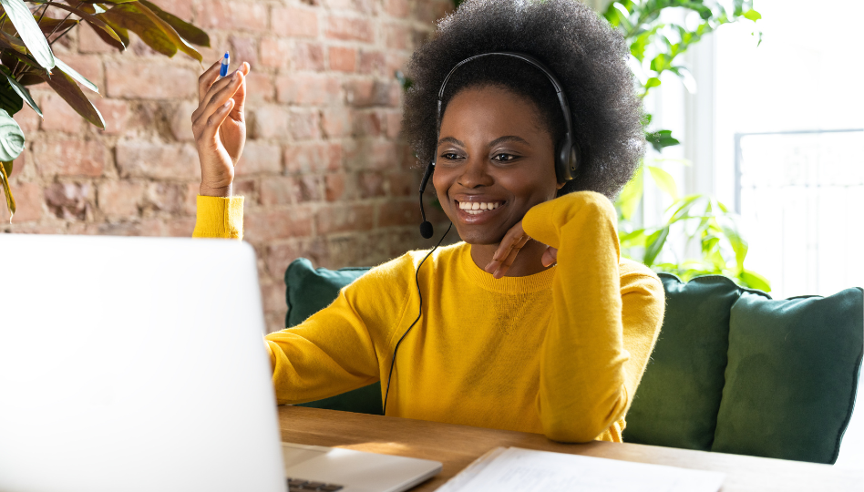 A women using her computer and smiling